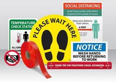 Assorted social distancing signs and floor markers